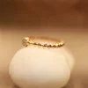 Celeste Dots – 18KT Gold Textured Band Ring
