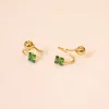 18 KT Gold Emerald Twist Stud Earrings 18 KT Gold Emerald Twist Stud Earrings