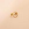 18 KT Gold Emerald Twist Stud Earrings